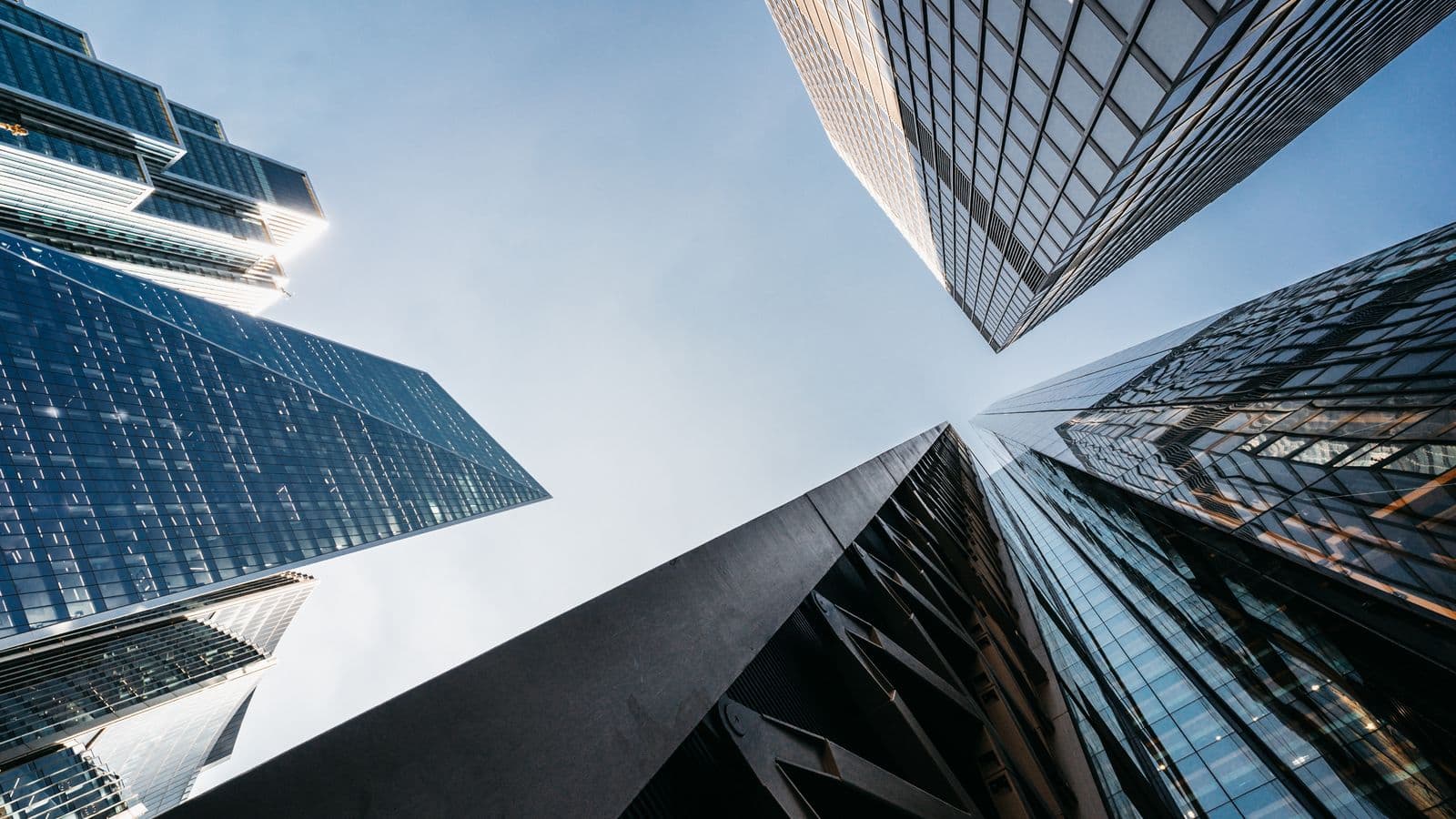 Glass towers viewed from within a financial district